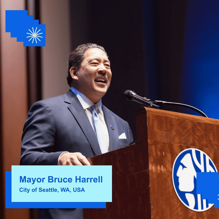 Seattle Mayor Bruce Harrell speaking at a podium