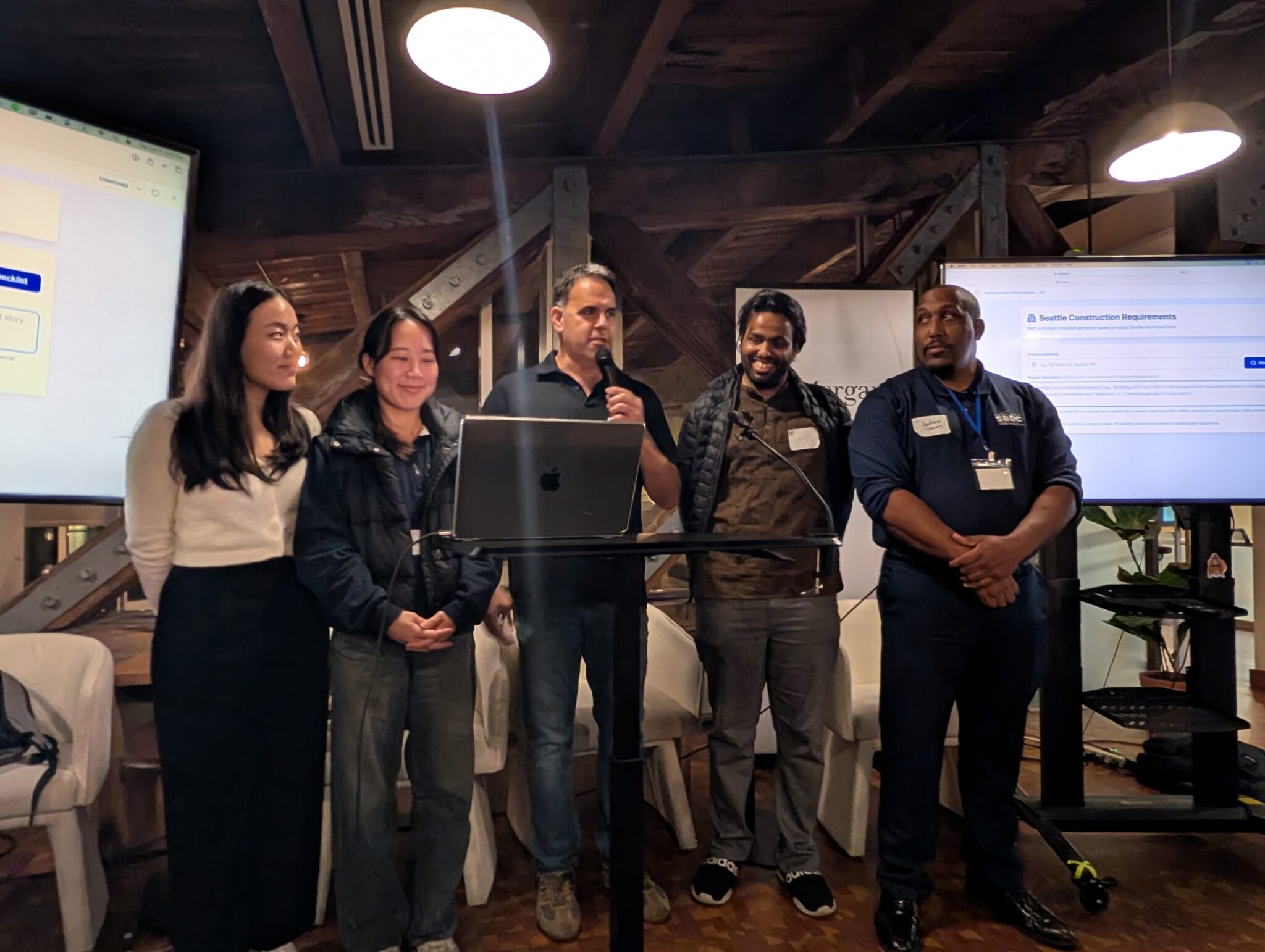 The five-person team presenting their project at the hackathon