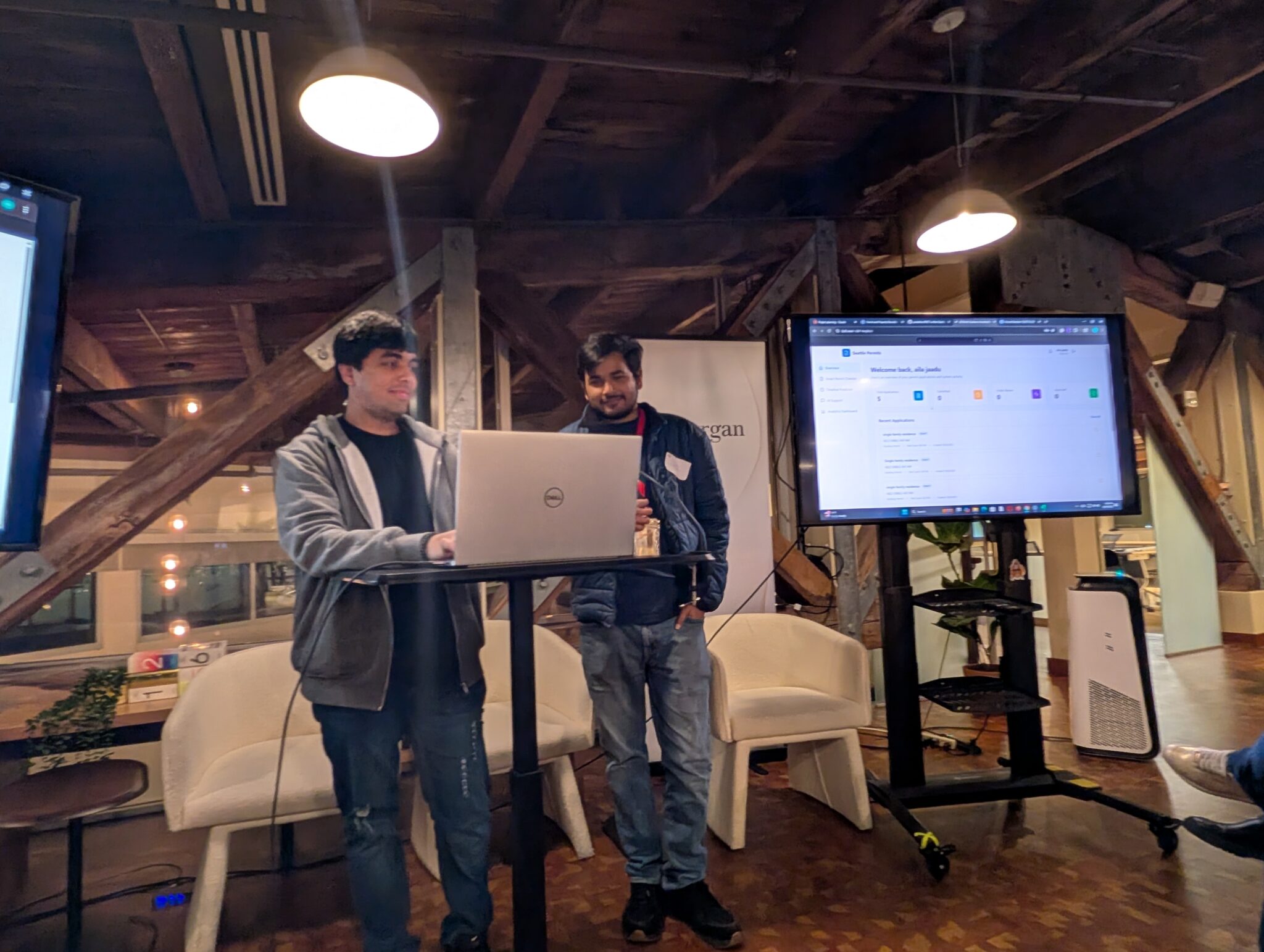 The two-person team HU Hackers presenting their project