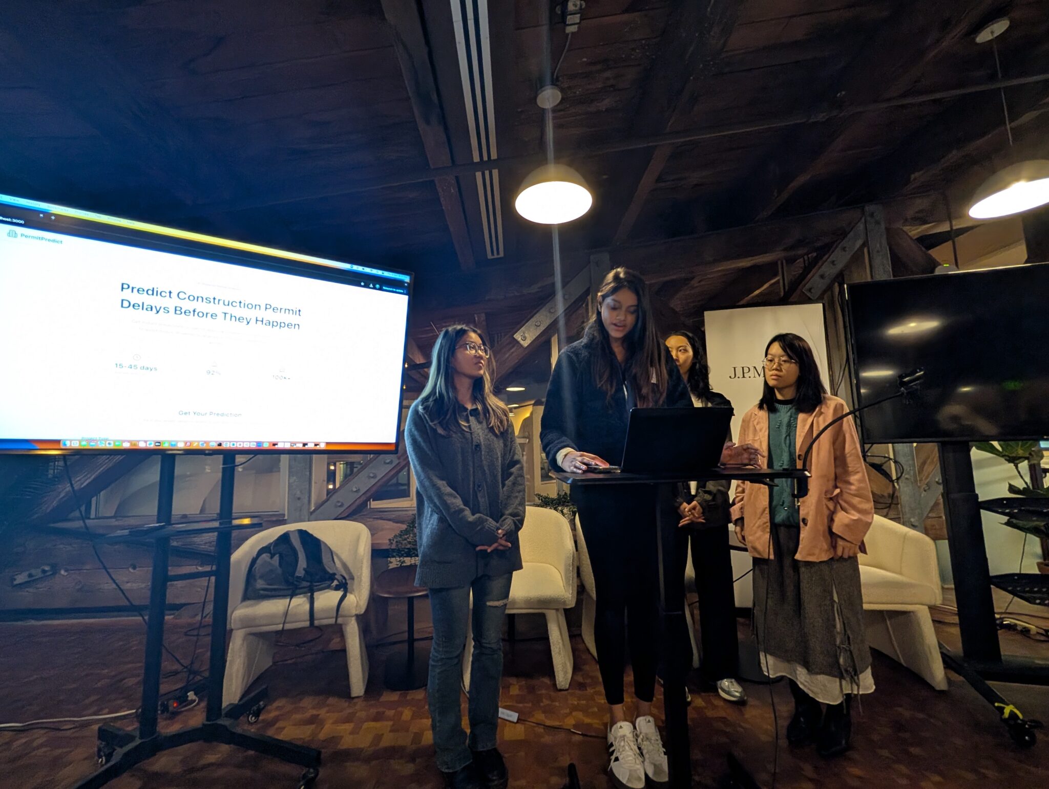 The four women in Team Null presenting their project at the hackathon. 