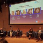 Five people sitting on a stage for a panel discussion called "Building and Sustaining Innovation Infrastructure"